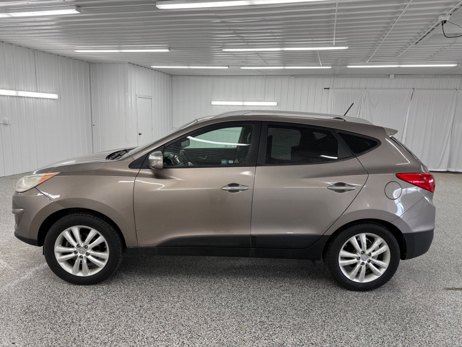 Used 2012 Hyundai Tucson Limited with VIN KM8JU3AC6CU378934 for sale in New Hampton, IA